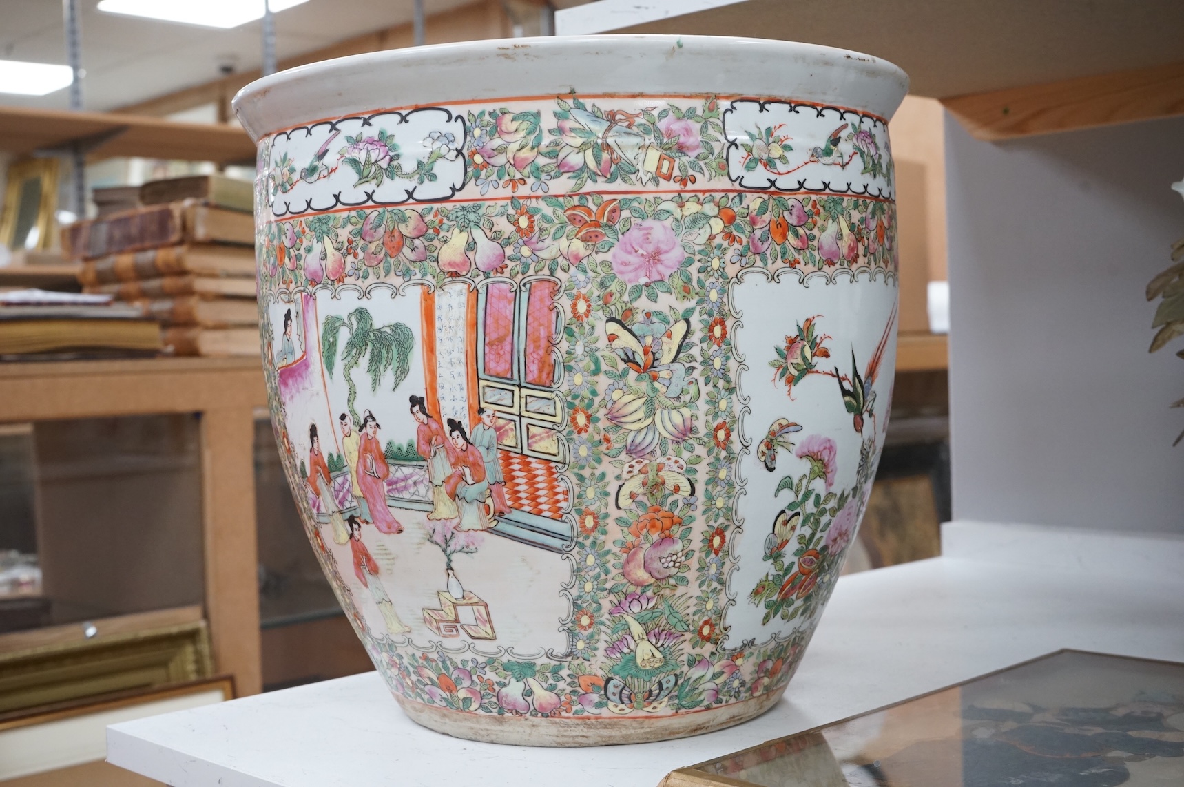 A Chinese famille Rose goldfish bowl enamelled with figures, butterflies and flowers, 41cm in diameter